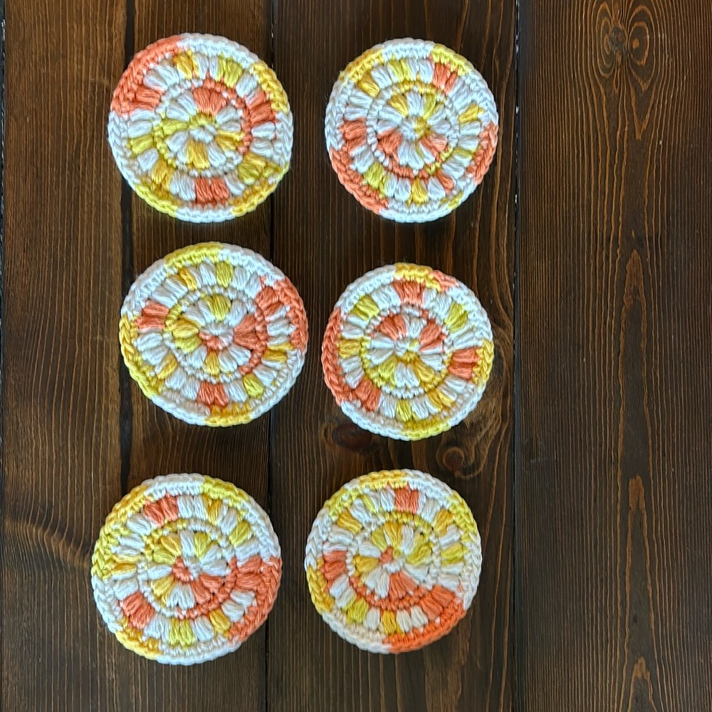 6 crocheted coasters orange , yellow and white